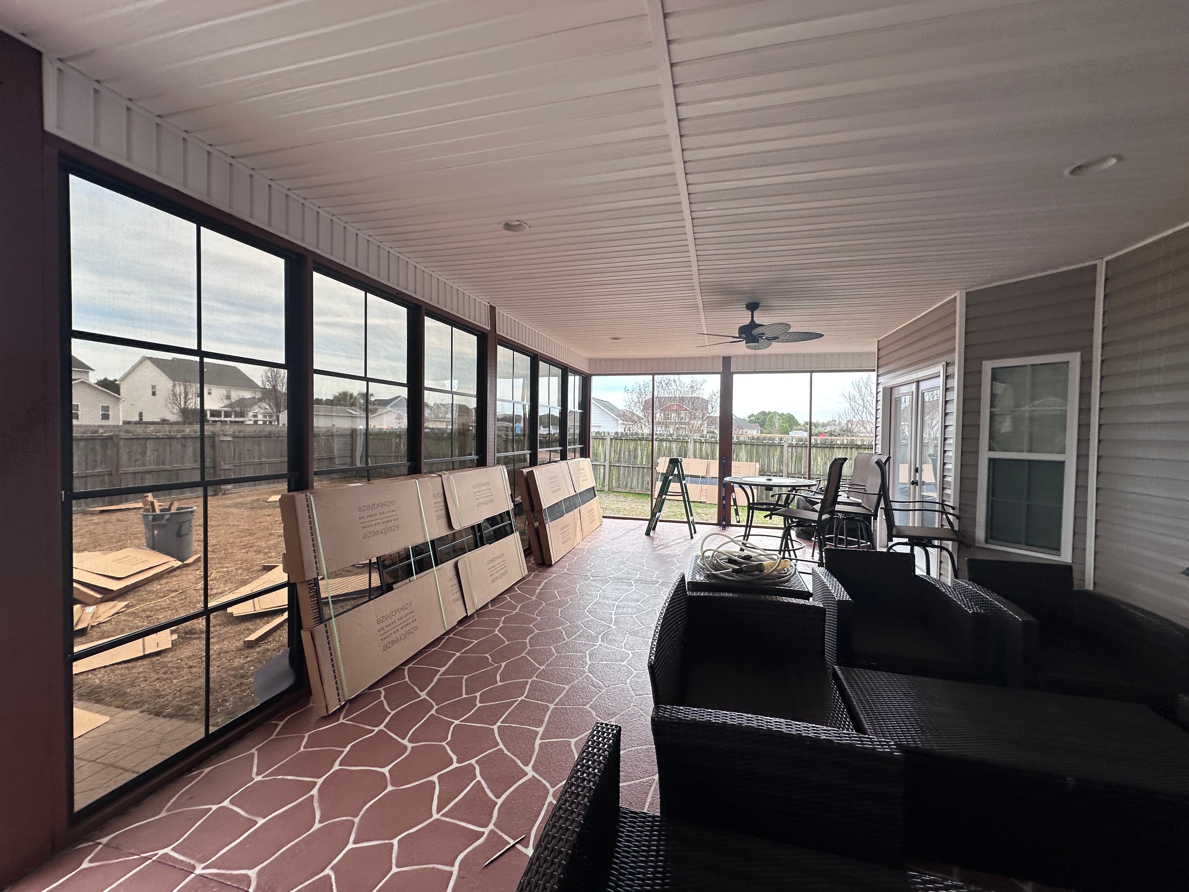 EZ Breeze sunroom interior with ceiling fan