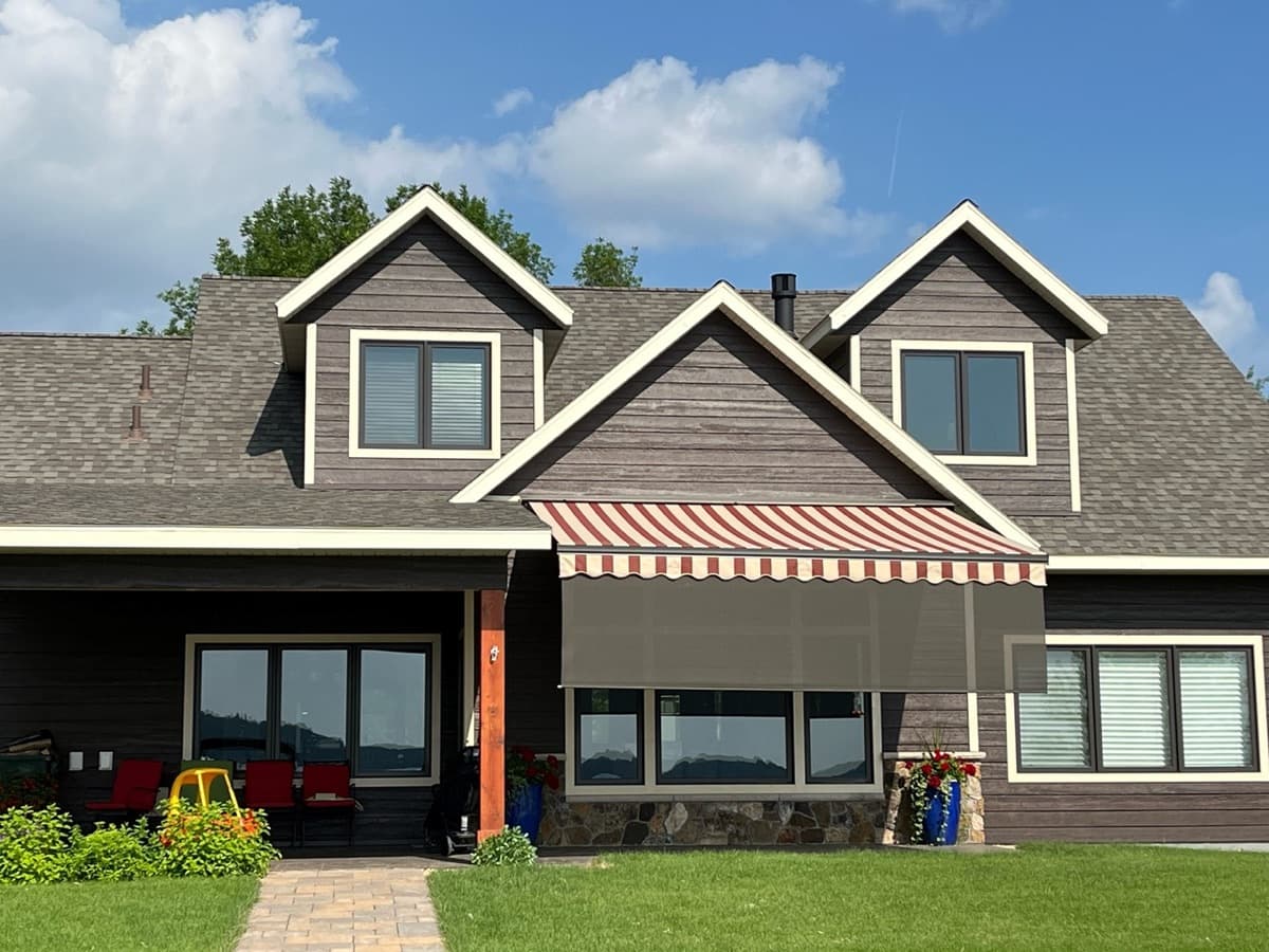 Red stripe retractable awning large home