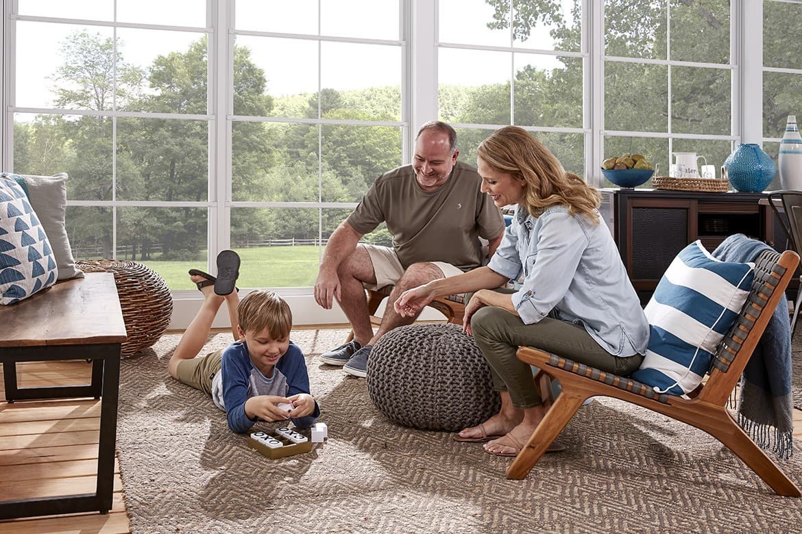 Family enjoying EZ Breeze sunroom